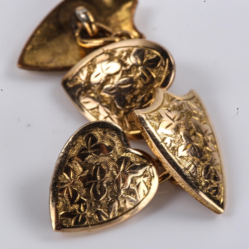 261 - A pair of Victorian rolled gold shield and heart panel cufflinks, engraved floral decoration, shield... 