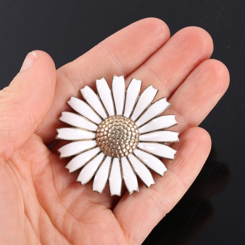 269 - ANTON MICHELSEN - a Vintage Danish vermeil sterling silver and white enamel daisy pattern brooch, br... 