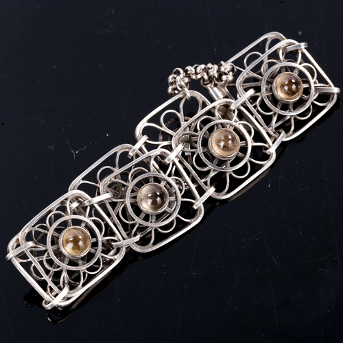 281 - F RIDIGER - a Vintage Danish silver and cabochon smoky quartz panel bracelet, openwork design, brace... 