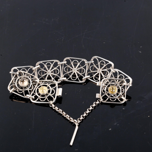 281 - F RIDIGER - a Vintage Danish silver and cabochon smoky quartz panel bracelet, openwork design, brace... 