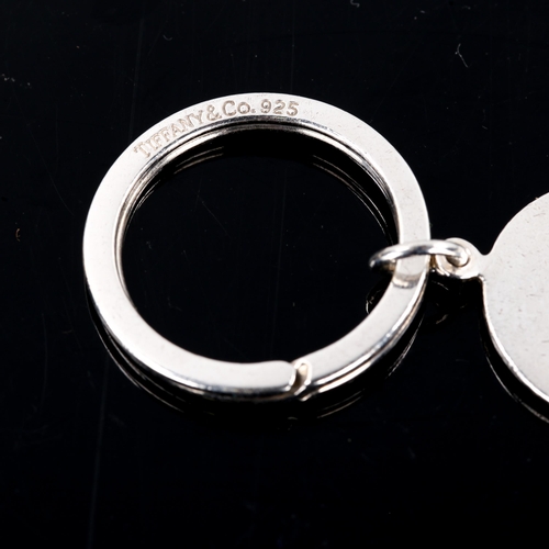 287 - TIFFANY & CO - a modern sterling silver globe keyring, dated 2000, globe diameter 22.5mm, 13g