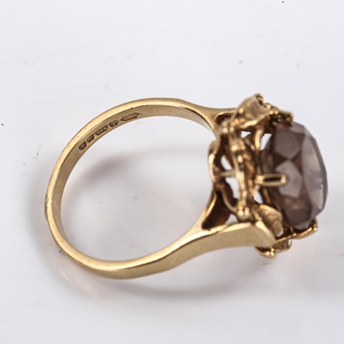 291 - A late 20th century 9ct gold smoky quartz dress ring, openwork leaf design set with oval mixed-cut q... 