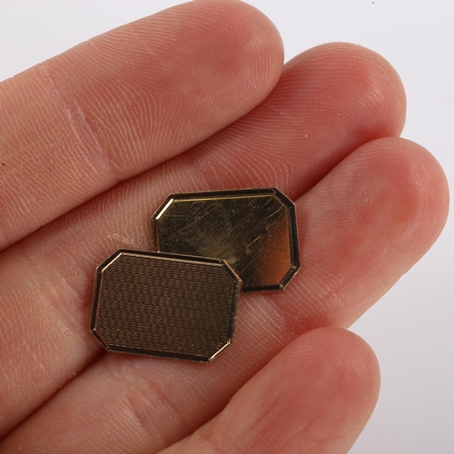 294 - A pair of mid-20th century 9ct gold octagonal panel cufflinks, engine turned and polished decoration... 