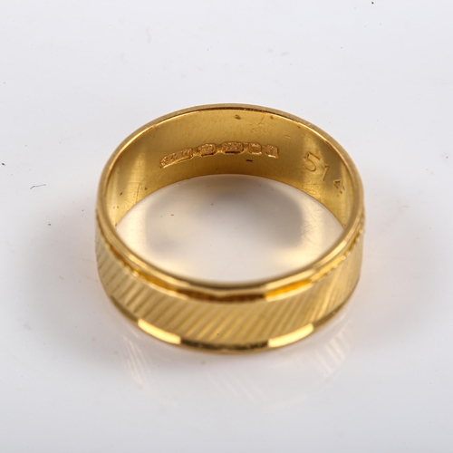 296 - A mid-20th century 22ct gold wedding band ring, engraved decoration, maker's marks S and W, hallmark... 