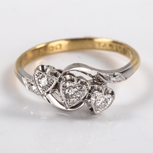 299 - An early 20th century 18ct gold diamond triple heart ring, platinum tops set with round brilliant an... 