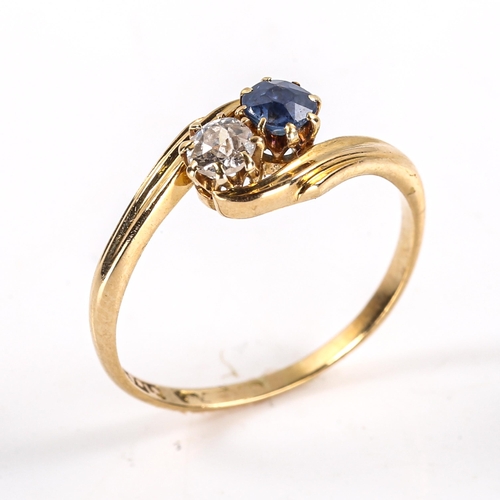 300 - An early 20th century 18ct gold 2-stone sapphire and diamond crossover ring, set with old European c... 