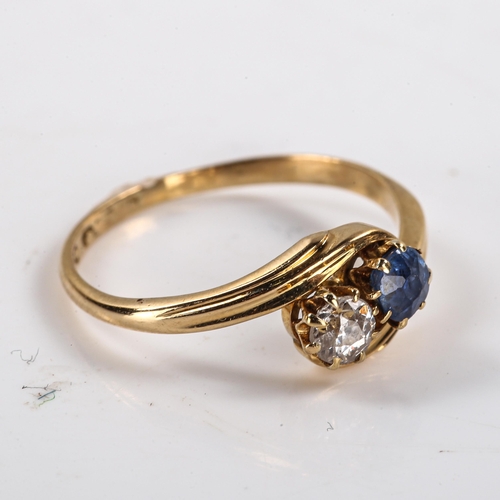 300 - An early 20th century 18ct gold 2-stone sapphire and diamond crossover ring, set with old European c... 