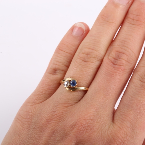 300 - An early 20th century 18ct gold 2-stone sapphire and diamond crossover ring, set with old European c... 