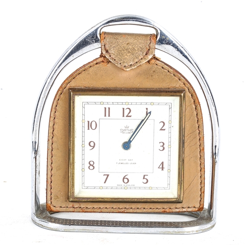 82 - SMITHS - a Vintage 8-day stirrup alarm mantel clock, white dial with Arabic numerals and swing leath... 