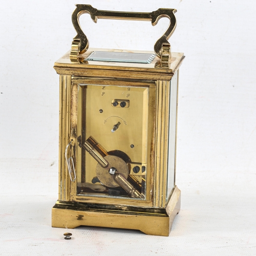 84 - J W BENSON - a brass cased carriage clock, white enamel dial with Roman numerals and exhibition glas... 