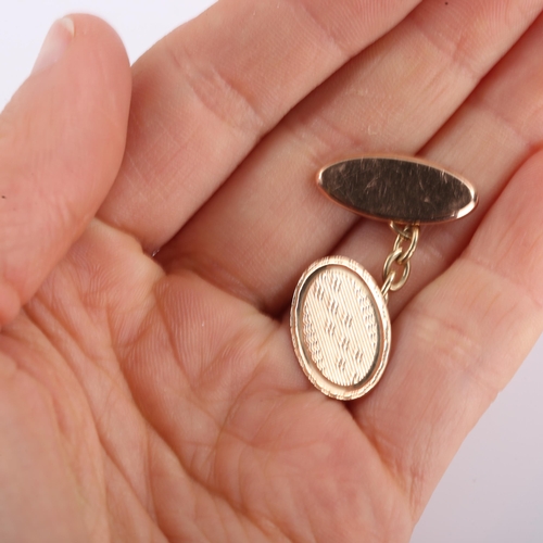 321 - A pair of early 20th century 9ct gold oval panel cufflinks, engine turned decoration, hallmarks Birm... 