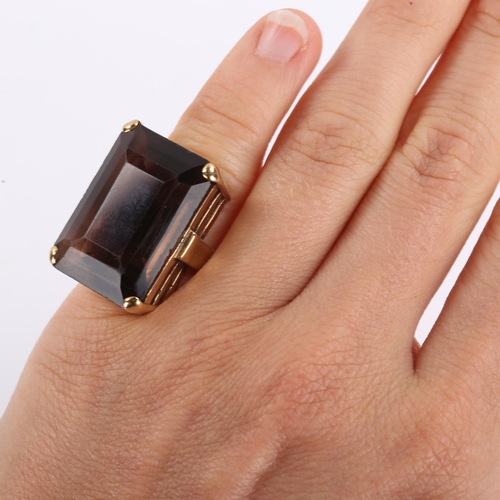 322 - A large mid-20th century 9ct gold smoky quartz dress ring, set with emerald step-cut quartz, hallmar... 