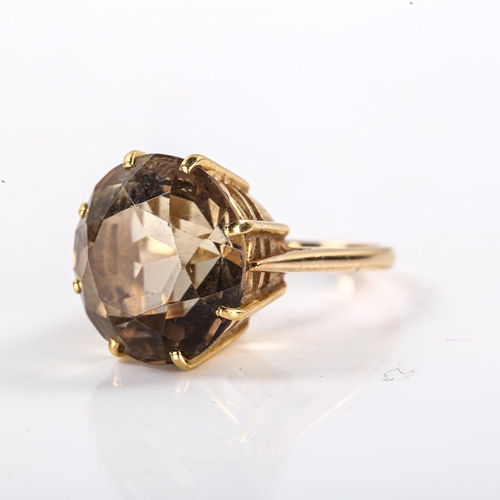 323 - A late 20th century 18ct gold smoky quartz dress ring, set with round-cut quartz, setting height 17.... 