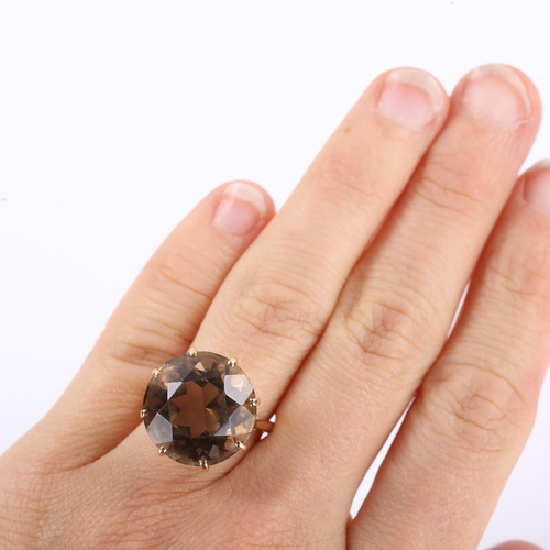 323 - A late 20th century 18ct gold smoky quartz dress ring, set with round-cut quartz, setting height 17.... 