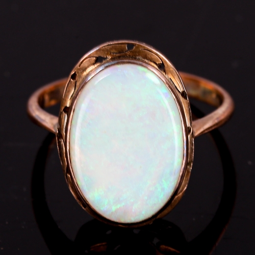 326 - A late 20th century opal dress ring, unmarked gold settings with oval thin cabochon white opal, sett... 