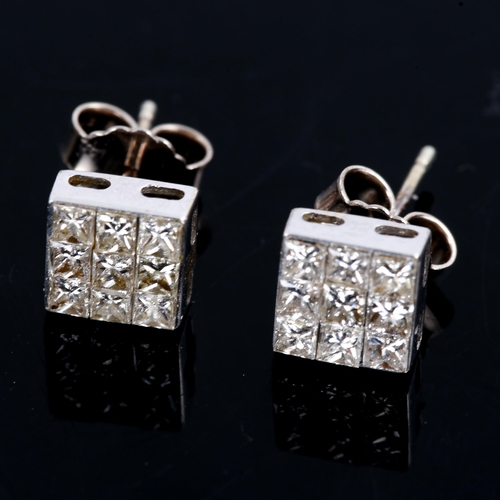 469 - A modern pair of Princess diamond cluster stud earrings, unmarked white metal settings, total diamon... 