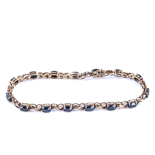 471 - A modern 9ct gold sapphire and diamond bracelet, set with oval mixed-cut sapphires and single-cut di... 