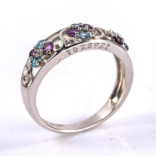 472 - A modern 9ct white gold amethyst blue topaz and diamond dress ring, openwork floral settings with ro... 