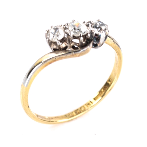 473 - An early 20th century 18ct gold 3-stone diamond crossover ring, set with old-cut diamonds, total dia... 