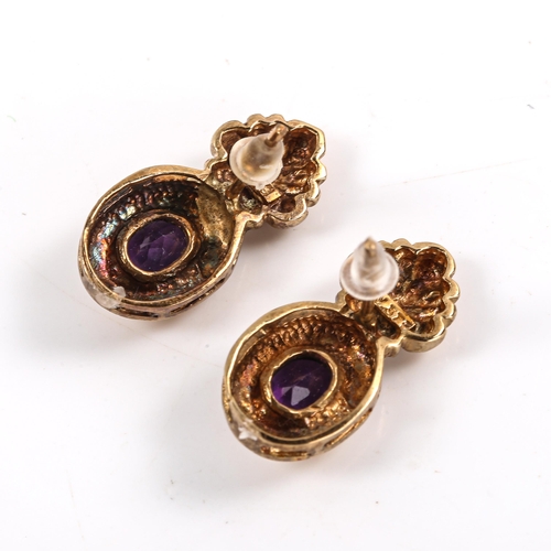 477 - A pair of late 20th century 9ct gold amethyst flaming torch stud earrings, set with oval mixed-cut a... 