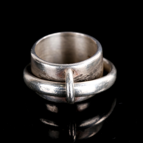 500 - CHARLOTTE MIELKO - a Danish heavy sterling silver Saturn band ring, band width 12.8mm, size approx N... 