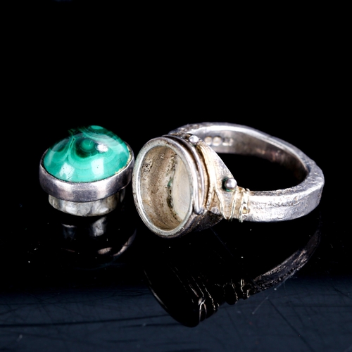 510 - GEORG JENSEN LIMITED - a late 20th century silver and malachite poison ring, gilded and textured wir... 