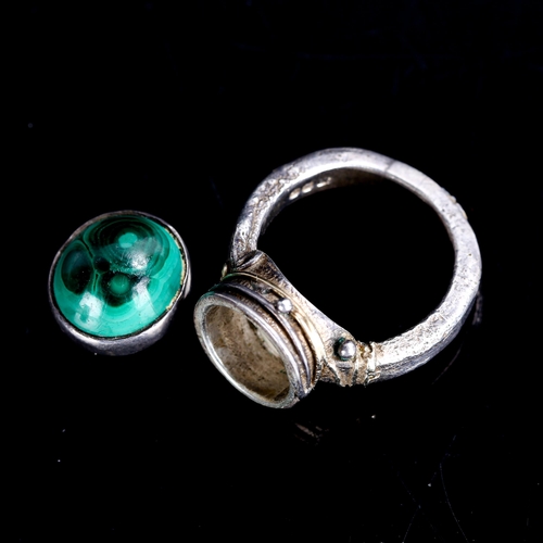 510 - GEORG JENSEN LIMITED - a late 20th century silver and malachite poison ring, gilded and textured wir... 