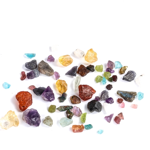 526 - Various unmounted rough gemstones, including fire opal, peridot, iolite, labradorite, tourmaline etc