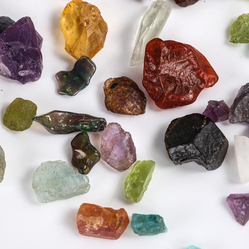 526 - Various unmounted rough gemstones, including fire opal, peridot, iolite, labradorite, tourmaline etc