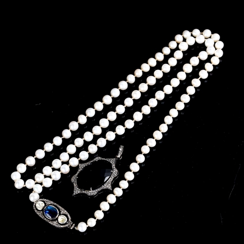 535 - A modern single-strand pearl necklace, with kyanite and diamond silver clasp, and a similar modern s... 