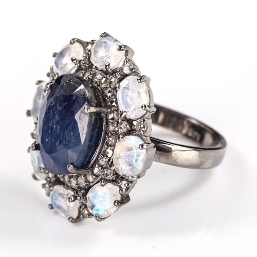 539 - A modern oxidised silver sapphire moonstone and diamond cluster ring, set with 7.40ct oval mixed-cut... 