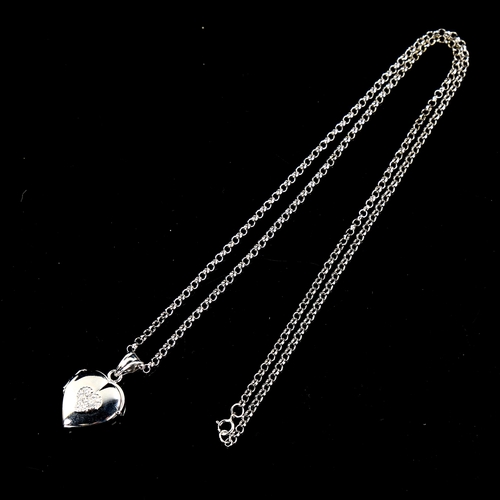 555 - A modern 9ct white gold cubic zirconia heart locket pendant necklace, on 9ct belcher link chain, pen... 