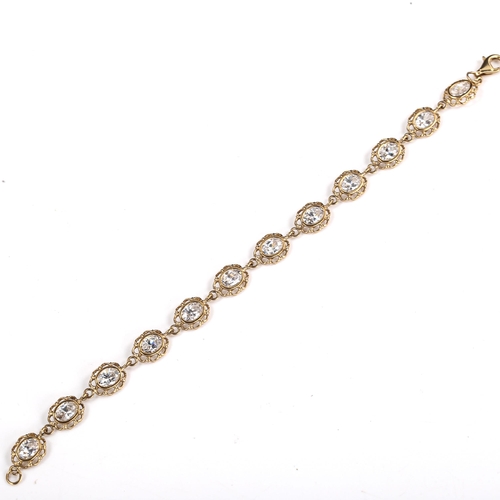 567 - A modern 9ct gold stone set bracelet, set with oval mixed-cut stones, bracelet length 19.5cm, 9.2g