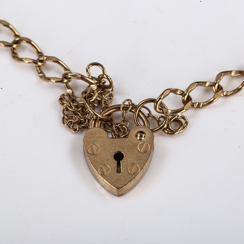 570 - A late 20th century 9ct gold heart padlock charm bracelet, hallmarks London 1988, length 16cm, 3.1g