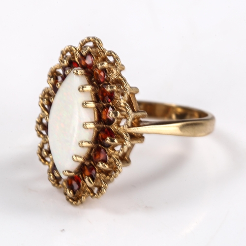 571 - A late 20th century 9ct gold opal and garnet marquise cluster ring, set with marquise cabochon white... 