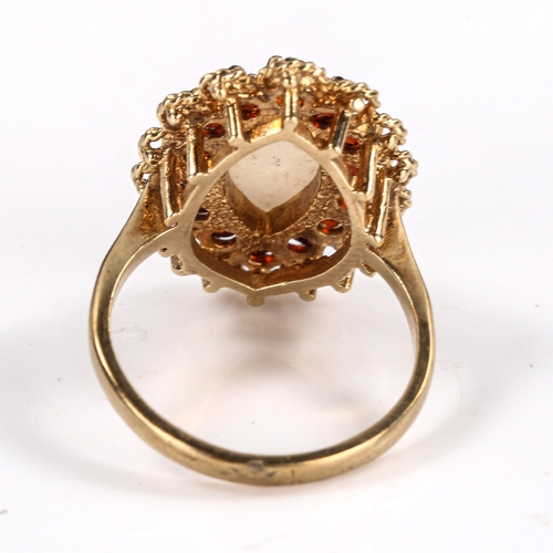 571 - A late 20th century 9ct gold opal and garnet marquise cluster ring, set with marquise cabochon white... 