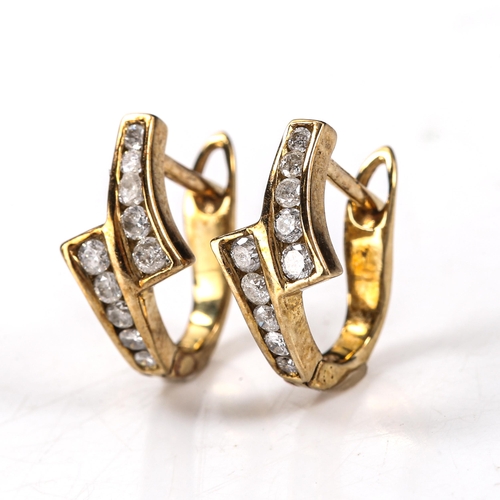 575 - A pair of diamond crossover earrings, unmarked gold settings with channel set modern round brilliant... 