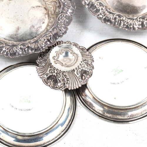 580 - Various silver dishes, including relief embossed foliate examples, and Aynsley Dublin University cer... 