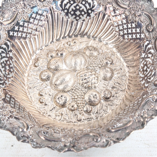 582 - A late Victorian silver sweetmeat bowl, relief embossed fruit and foliate decoration with pierced an... 