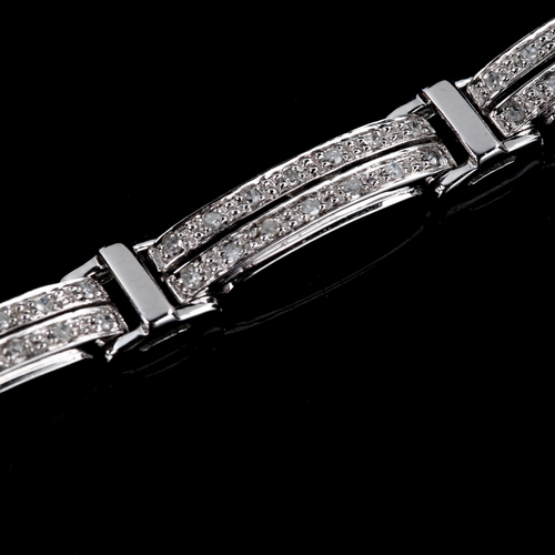 592 - A modern 9ct white gold diamond panel bracelet, set with single cut diamonds, bracelet length 18.5cm... 