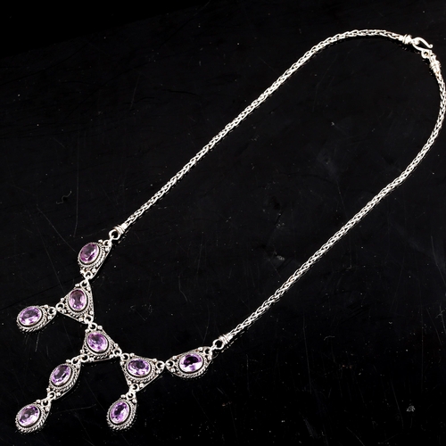 597 - A modern silver and amethyst fringe necklace, set with oval mixed cut amethysts, necklace length 45c... 