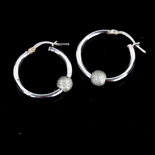 598 - A pair of modern 9ct white gold hoop earrings, with sliding textured bead and French lock fitting, h... 