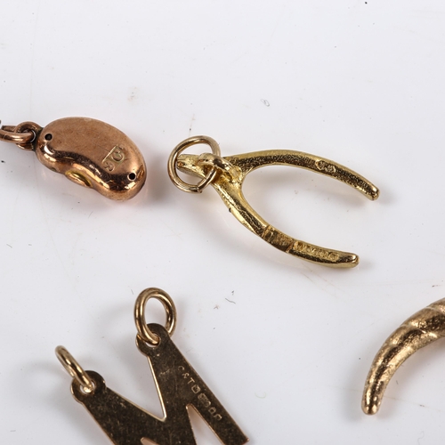 606 - Various 9ct gold charms and pendants, including wishbone, magic bean, boxing glove etc, 9.7g total