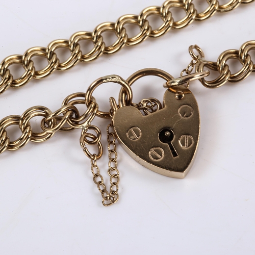 607 - A late 20th century 9ct gold double link heart padlock charm bracelet, hallmarks London 1976, length... 