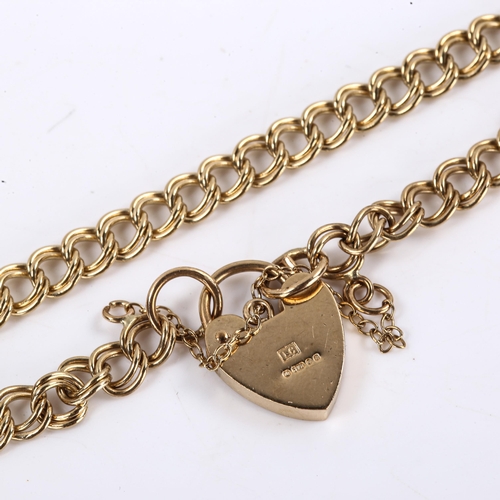 607 - A late 20th century 9ct gold double link heart padlock charm bracelet, hallmarks London 1976, length... 