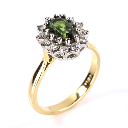 611 - An 18ct gold green tourmaline and diamond cluster ring, set with oval mixed cut tourmaline and moder... 