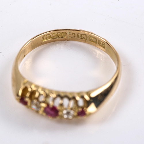 612 - An early 20th century 18ct gold graduated 5-stone ruby and diamond half hoop ring, set with round cu... 