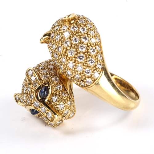 614 - A large modern 18ct gold sapphire and diamond double panther head dress ring, inspired by Cartier Pa... 