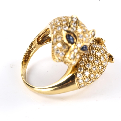 614 - A large modern 18ct gold sapphire and diamond double panther head dress ring, inspired by Cartier Pa... 