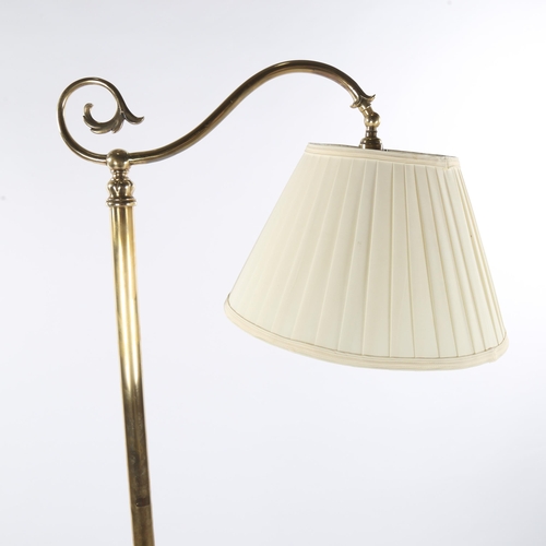 1137 - A brass standard lamp, late 19th/early 20th century, on heavy cast tricorn-shaped base, modern fabri... 